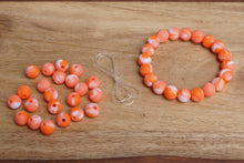 Load image into Gallery viewer, orange tie-dye silicone bead bracelet kit