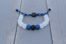 Load image into Gallery viewer, translucent adjustable silicone bead bracelet on blue and black paracord