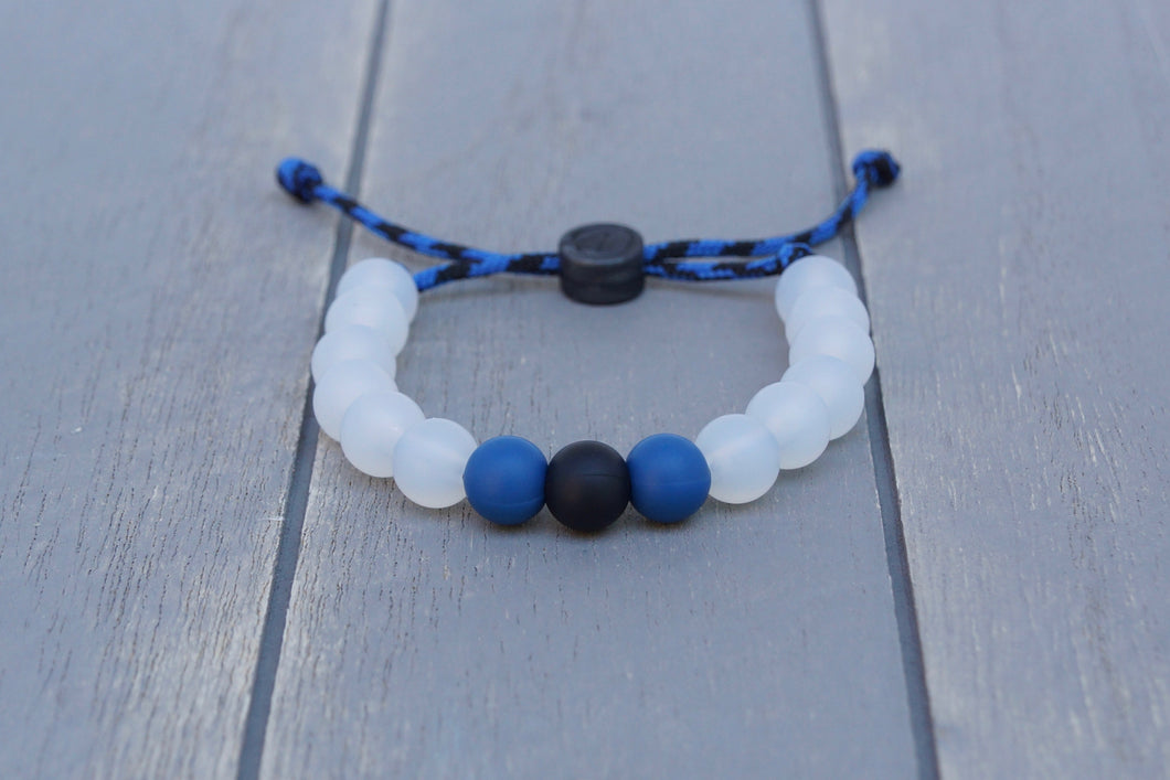 translucent adjustable silicone bead bracelet on blue and black paracord