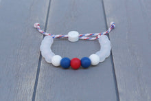 Load image into Gallery viewer, translucent adjustable silicone bead bracelet on hockey lace paracord
