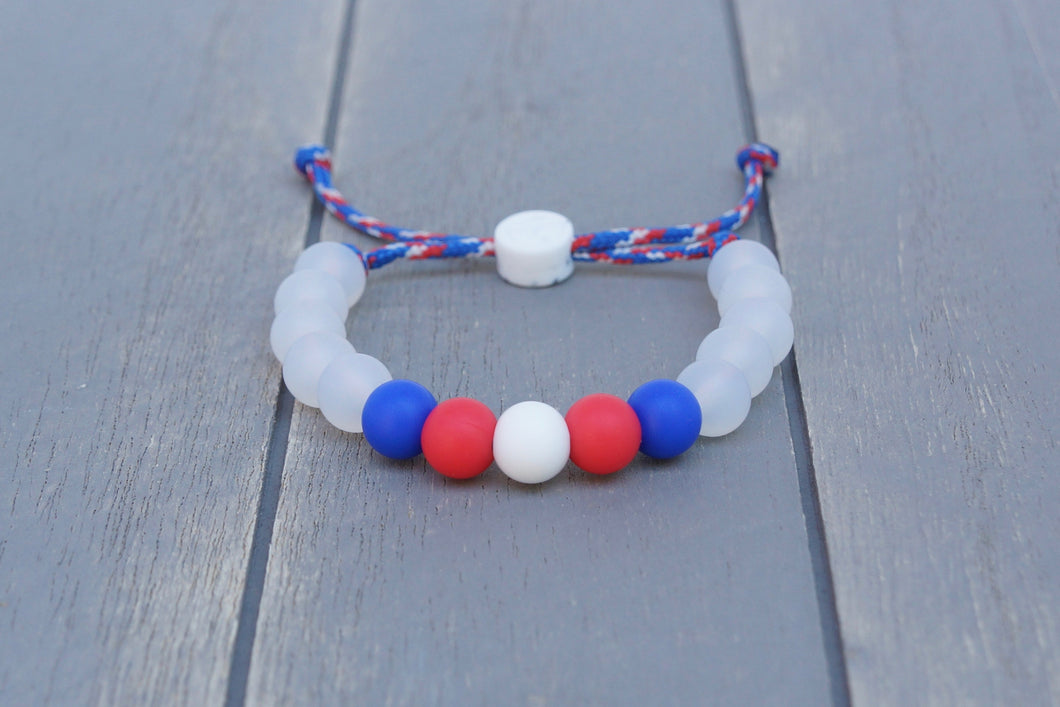translucent  adjustable silicone bead bracelet on blue, white and red paracord