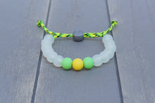 Load image into Gallery viewer, translucent  adjustable silicone bead bracelet on yellow and green paracord 