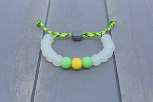 translucent  adjustable silicone bead bracelet on yellow and green paracord 