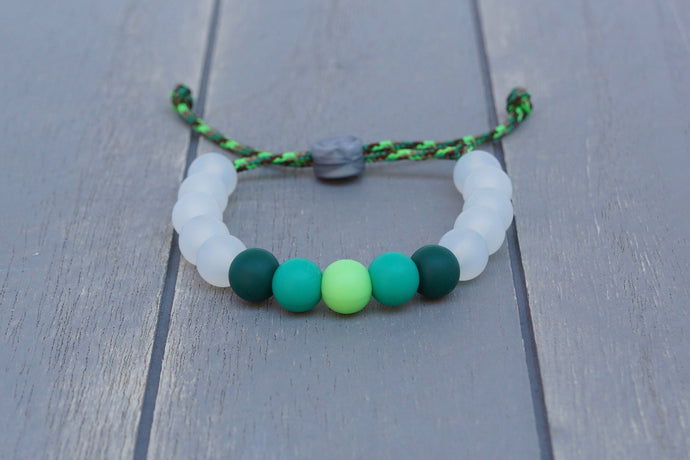 Translucent adjustable silicone bead bracelet on multi-green paracord