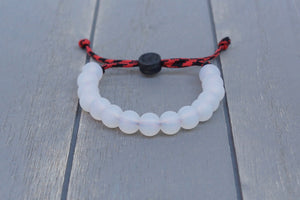 Translucent adjustable silicone bead bracelet on black and red paracord