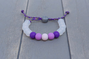 Translucent adjustable silicone bead bracelet on purple paracord