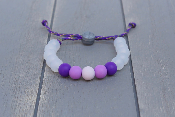 Translucent adjustable silicone bead bracelet on purple paracord