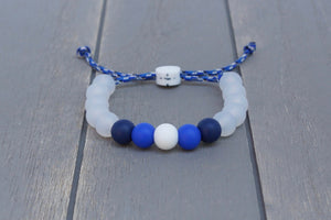 Translucent adjustable silicone bead bracelet on blue camo paracord