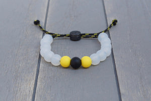 Translucent adjustable silicone bead bracelet on black and yellow paracord