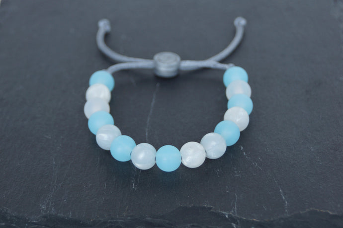 Translucent and metallic white and blue adjustable silicone bead bracelet