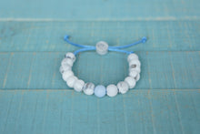 Load image into Gallery viewer, marble with blue accent bead  adjustable silicone bracelet