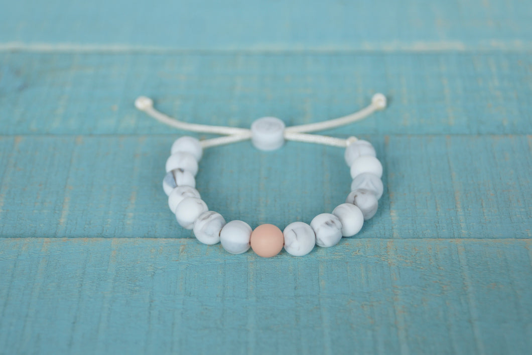 white marble and peach accent bead adjustable silicone bracelet