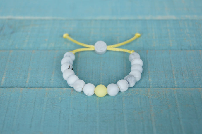 White Marble with yellow accent bead adjustable silicone bracelet