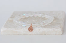 Load image into Gallery viewer, White moonstone bracelet on elastic with rose gold tag