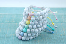 Load image into Gallery viewer, White marble with pastel accent bead adjustable silicone bracelets