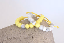 Load image into Gallery viewer, Set of 2 white marble and yellow adjustable silicone bead bracelets